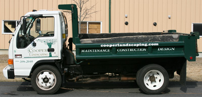 A Cooper Landscaping mini dump truck